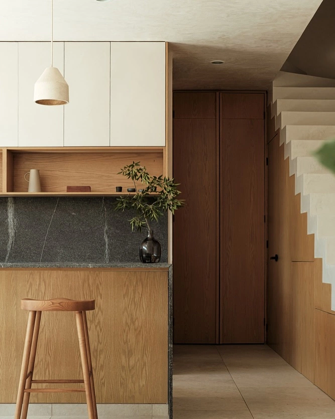 Cream Cabinetry with Marble Backsplash